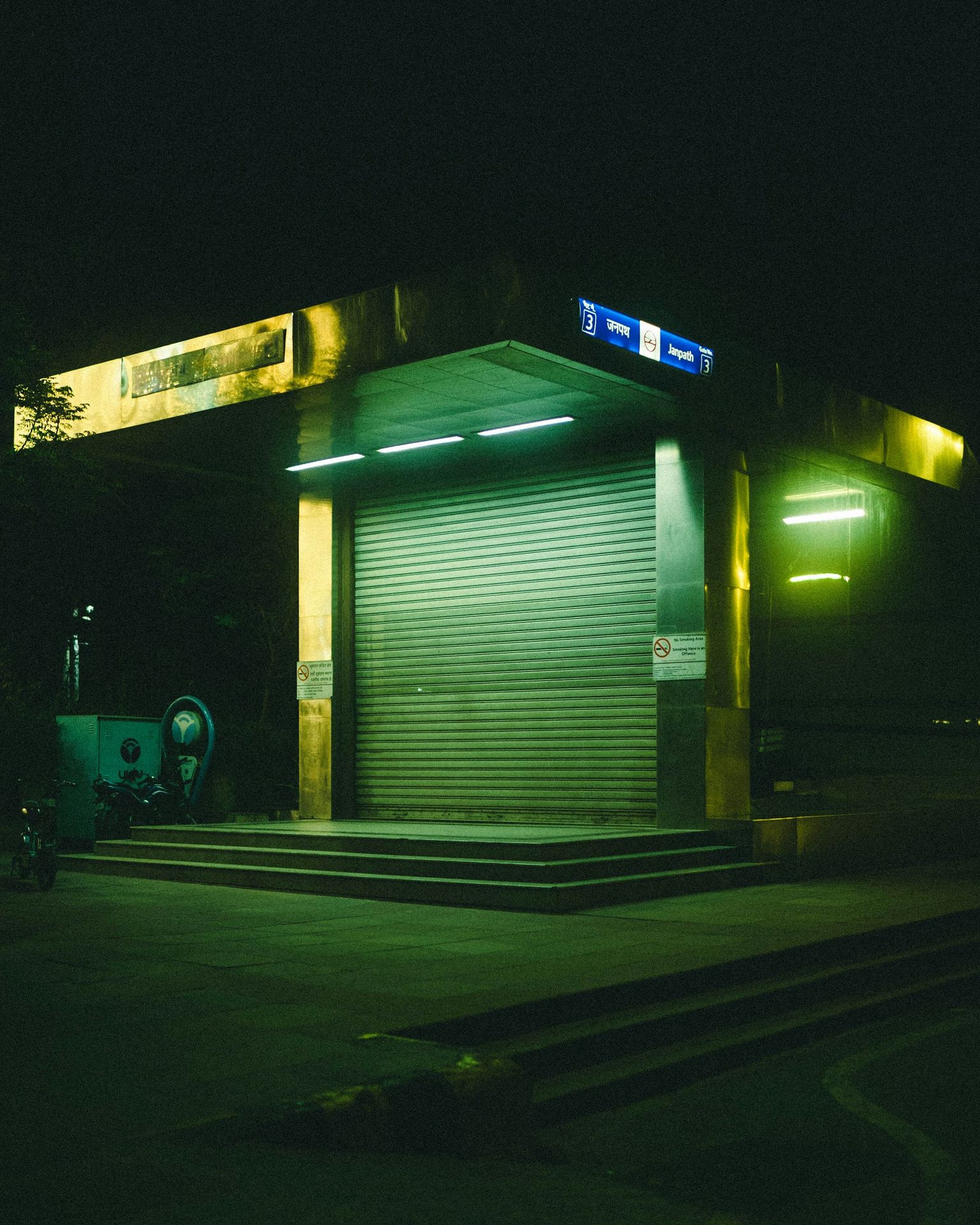 a building with a sign on the roof at night